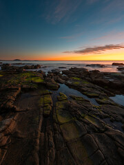 Beautiful rocky coastline view at dawn, Sunshine Coast, Australia.