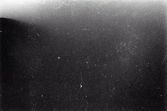 Blank grained film strip texture background with heavy grain, dust and fingerprint
