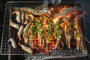 Hoi An, Vietnam - 4 Feb, 2024: Giant Lobsters on sale at a seafood stall in Hoi An night market