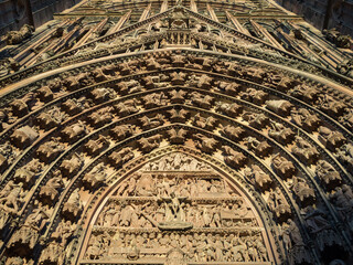 Detail of the sculptural work of the tympanum and archivolts of the west doorway of Cathedral of...