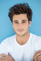 Fototapeta premium Confident Young Man with Trendy Hairstyle on Blue Background