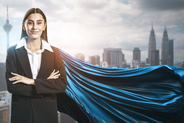 A confident woman with a flowing blue cape on a cityscape background, symbolizing power and leadership. Generative AI