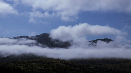 Mountain landscape with fog in the valley