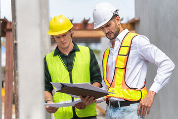 Engineer and foreman worker team inspect the construction site, Site manager and builder on construction site