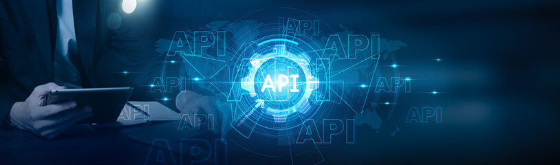 API. Businessman using laptop and analysis API integration strategies with business growth on digital transformation, customer engagement, data analytics, and innovation initiatives on global network.