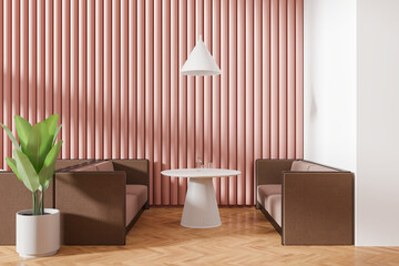 Colored cafe interior with sofa and round table, plant on hardwood floor