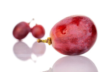 Three grapes, macro, isolated on white background.