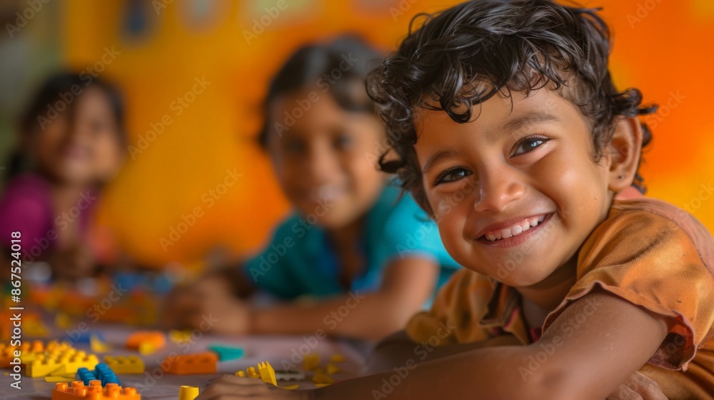 Poster happy child playing with colorful building blocks