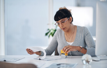 Business woman, reading and paperwork with stamp for approval, review or validation at office....