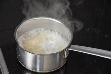Cooking white rice in a saucepan