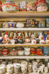 Hoi An, Vietnam - 8 Feb, 2024: Traditional Vietnamese ceramic bowls displayed for sale in a shop in Hoi An Old Quarter