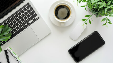 Telephone and laptop on white table, background
