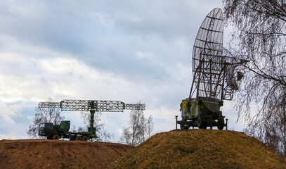 Military Radar Systems in a Cloudy Landscape
