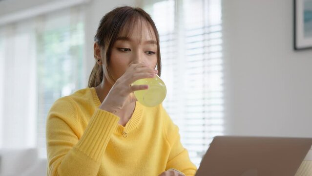Happy fresh asia people young adult woman take skin care detox pill folic iron drinking diet zinc vit c d boost water for worker enjoy relax work at home desk. Herbal juice glass refresh immune system
