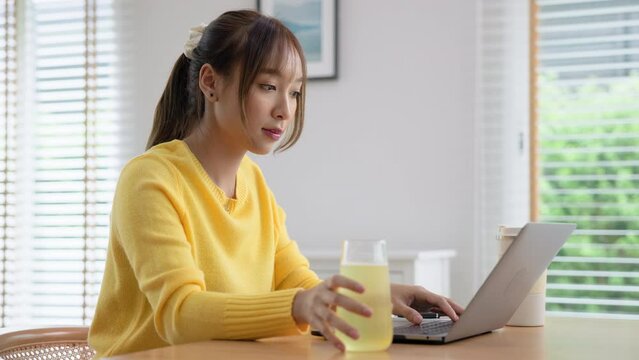 Happy fresh asia people young adult woman take skin care detox pill folic iron drinking diet zinc vit c d boost water for worker enjoy relax work at home desk. Herbal juice glass refresh immune system