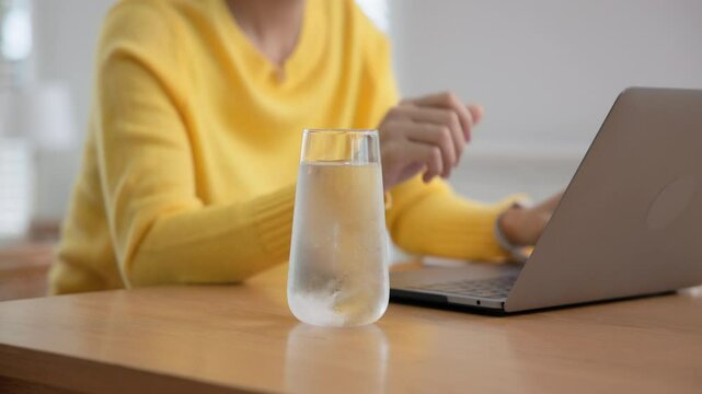 Happy fresh asia people young adult woman take skin care detox pill folic iron drinking diet zinc vit c d boost water for worker enjoy relax work at home desk. Herbal juice glass refresh immune system