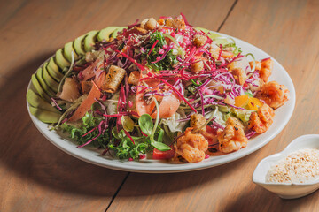 Mixd Salad  in White Plate on Wooden Table.
