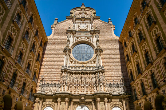MONTSERRAT, SPAIN - MAY 11, 2024: General view of the facade at the entrance of the Basilica of Santa María de Montserrat