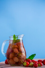 Sweet refreshing berry compote of ripe strawberries in a decanter