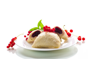 steamed sweet homemade dumplings with berries, red currants