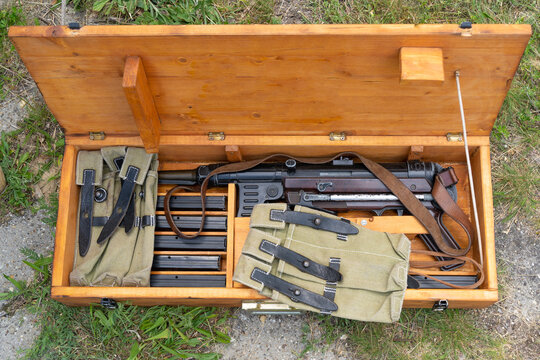 WWII MP-40 German submachine gun with spare magazines and pouches in a gun box