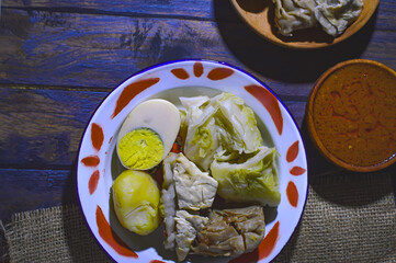 Siomay are steamed fish and vegetable dumplings served with peanut sauce.  Traditionally made from mackerel fish.  Siomay is a typical Bandung city food.