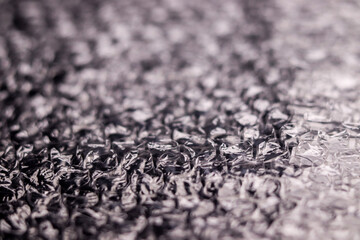 Plastic wrap air bubble packaging material on black background