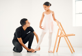 Obraz premium Ballet, balance and coach with student for learning, development and sport or dance class. Creativity, man and girl child or ballerina in theatre for training, support and mentor for art in studio