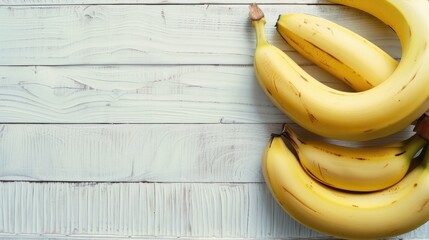 Bunch of bananas isolated on a white wooden background