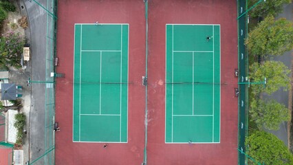 Kuching, Malaysia - June 29 2024: Aerial Top Down View of Tennis Court and Basketball Court