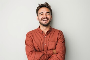 Obraz premium portrait of happy, stylish confident 35-year-old caucasian man in orange shirt on white background