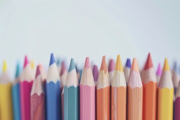 Color pencils (standing upright) (arranged by hue) (soft pastel tones) (white tabletop background)....