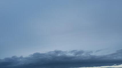 Fluffy layered clouds sky atmosphere. Majestic amazing blue sky with clouds. White and blue colors. Timelapse.