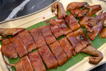 Roasted whole suckling pig served on plate