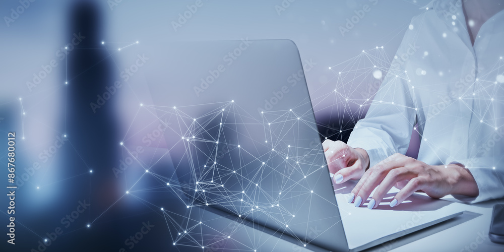 Poster person using a laptop with abstract digital network connections overlaid, with a blurred background,