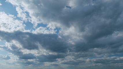 Obraz premium Beautiful blue sky with stratocumulus and clouds background. Sky with clouds weather nature cloud blue. Timelapse.