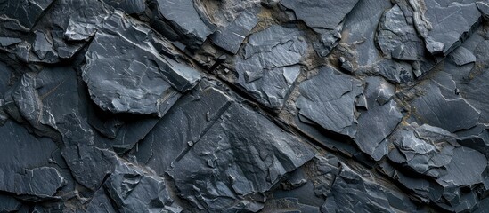 Slate background or texture in dark shades of grey and black.