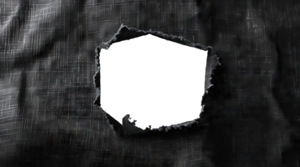 Hole in black fabric with frayed edges, cut out