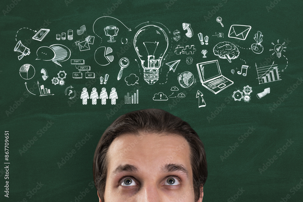 Poster a man looking upwards with a chalk-drawn variety of icons and symbols floating above his head agains