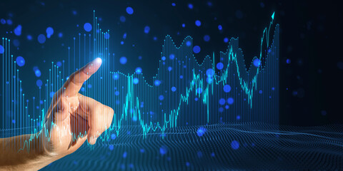 A hand interacting with digital stock market graphs on a dark blue background, illustrating financial technology or investment concepts