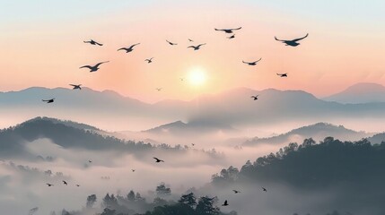 Obraz premium Foggy morning in the mountains with flying birds over silhouettes of hills. Serenity sunrise with soft sunlight and layers of haze. Mountain landscape with mist in woodland in pastel colors.