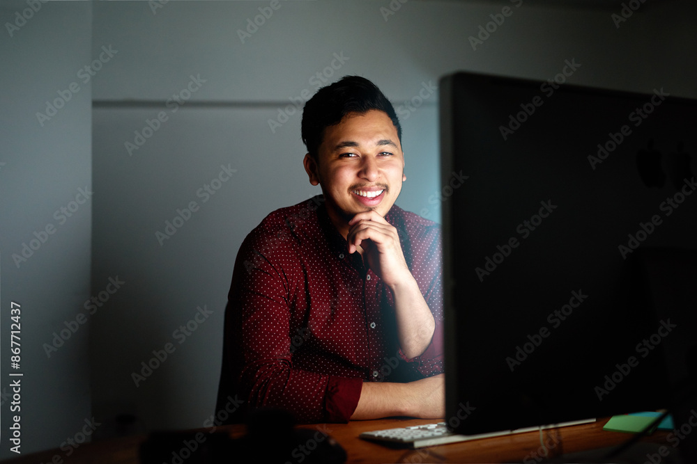 Poster Smile, man and computer at night in office of coding, problem solving and software design as Developer. Male person, programmer and pc update with IT help for deadline maintenance by working late