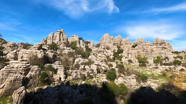 Hiking in the Torcal de Antequerra National Park, limestone rock formations and known for unusual karst landforms in Andalusia, Malaga, Spain.