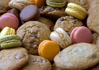 Close up on tray of assorted cookies, macarons and chocolate chip.