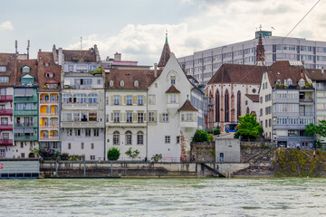 Basel city- A bridge spans Rhein river with a city in the background