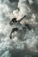 businessman jumping on the clouds