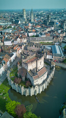 Enchanting aerial view of Bruges' historic old town captured by a drone at night! The illuminated medieval architecture, winding canals, and charming cobblestone streets create a magical and captivati