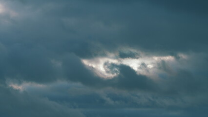 Obraz premium Dark Huge Cloud In Sky. Massive Cumulus Clouds Rolling. Wind Disperses Clouds On A Rainy Day.