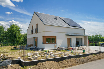 New build modern house with gable roof and solar panels 