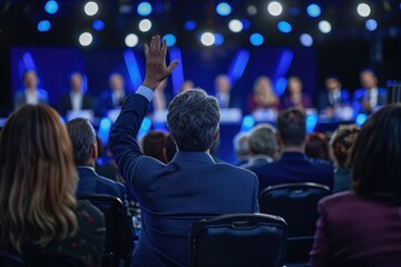 Man Raising Hand In Audience